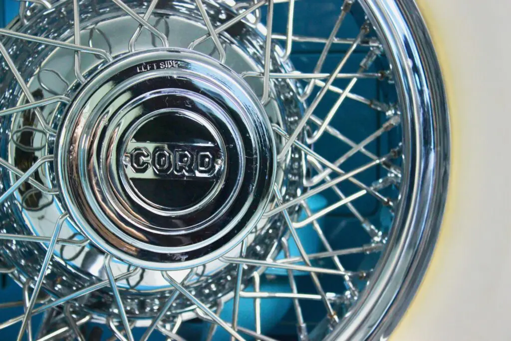 Close up of the spare wheel of a blue Cord L-29