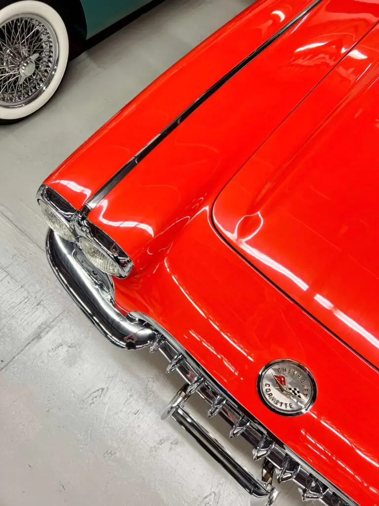 Stylized bird's eye view of an orange Corvette