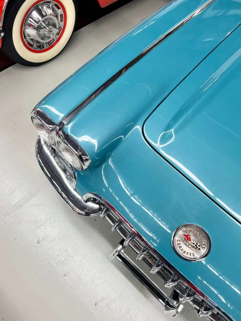 Stylized bird's eye view of a blue Corvette