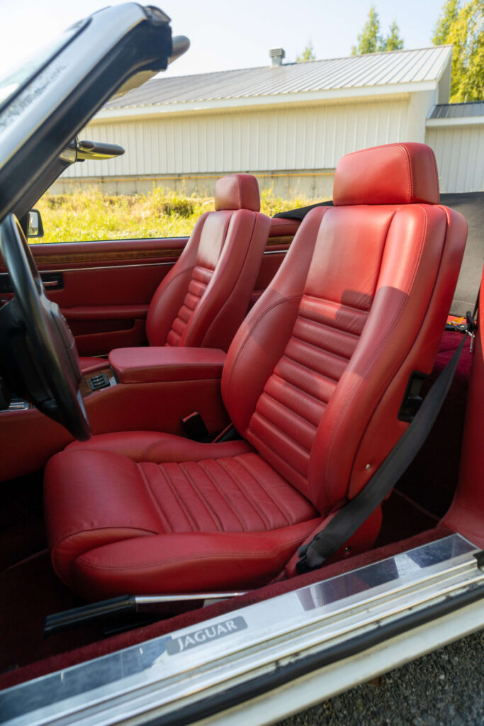 Front seat of a Jaguar XJS. The seat are made of rich red leather