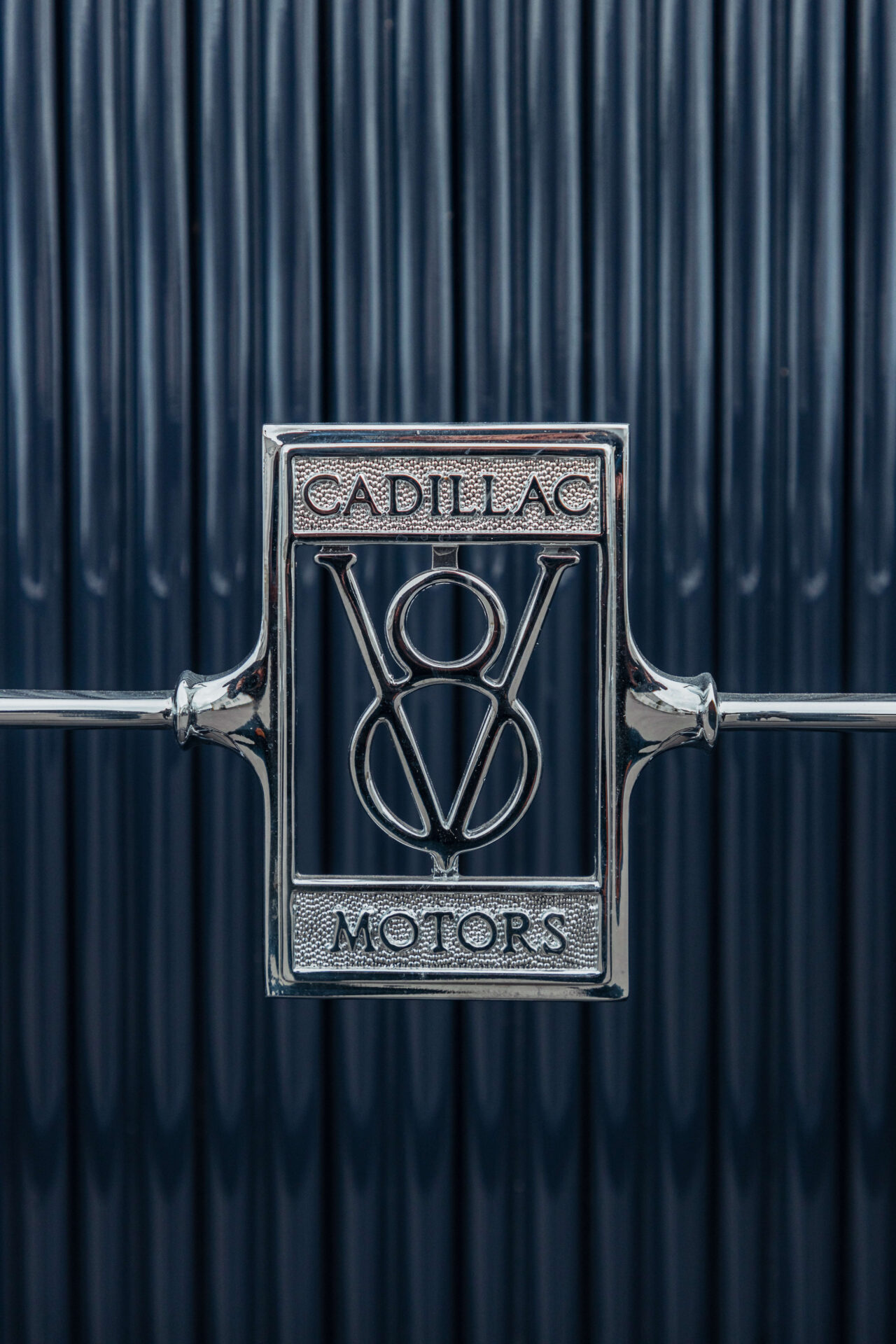 Close up of the Cadillac V8 badge on a Cadillac 1928 grille