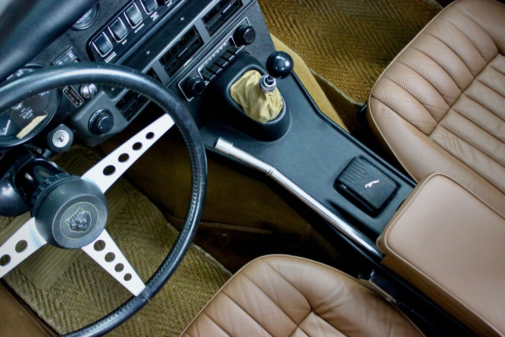 The inside of a Jaguar E-Type, called the most beautiful car in the world, it was imagined by William Lyons