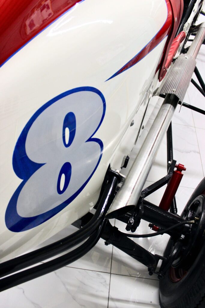 Close up of the number "8" on the side of a old school race car.