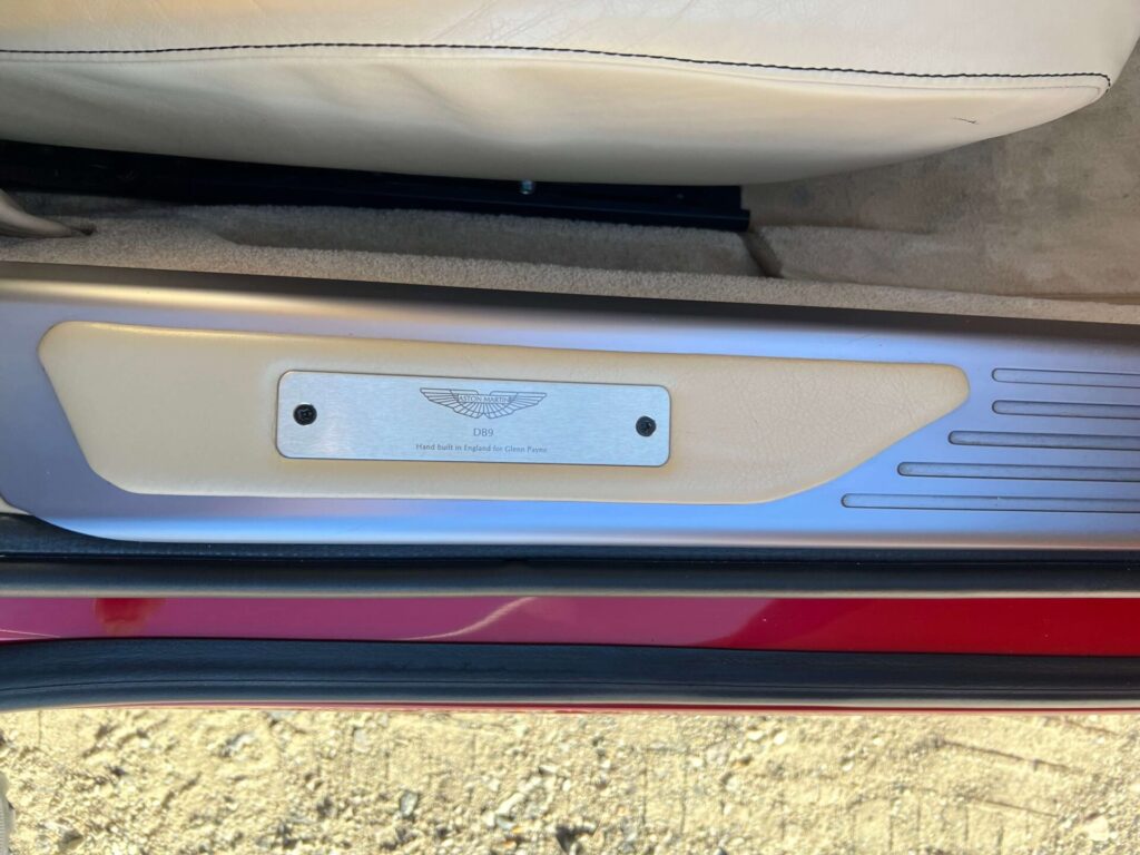 Plaque inside the driver's side door of an Aston Martin SB9 Volante