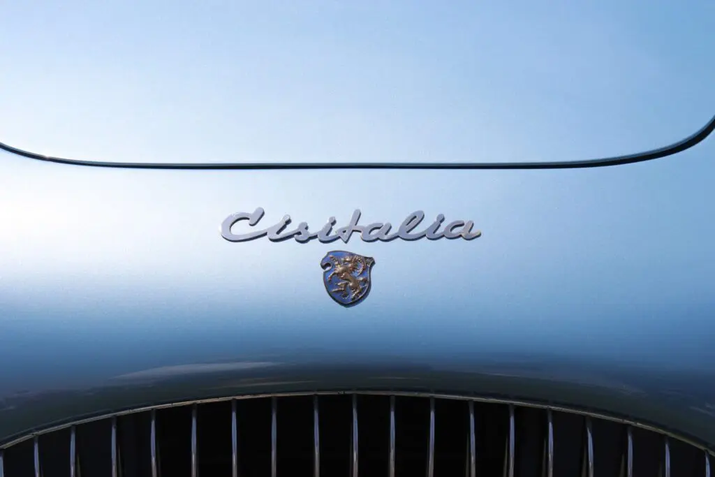Close up of the logo and Cisitalia name on a light blue car