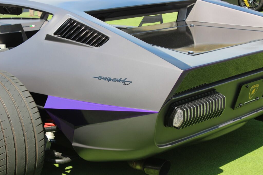 Close up of the logo "Espada" on a futuristic-looking grey vehicle with purple accents.