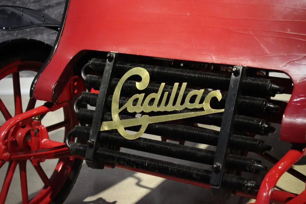 Close up of the Cadillac logo on a red Model A Cadillac
