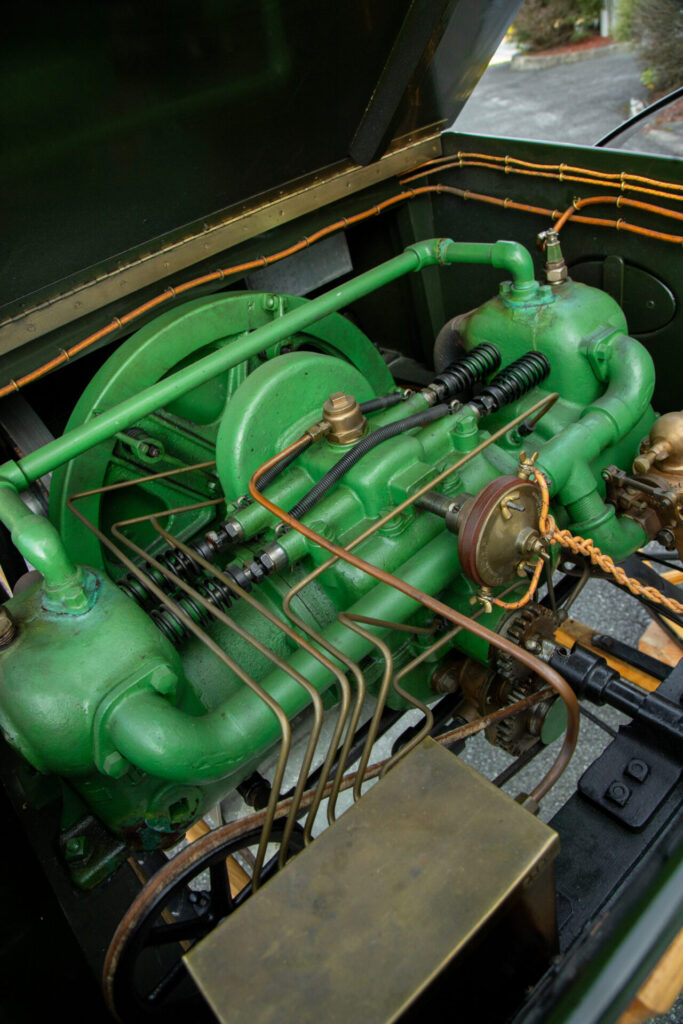 The green-coloured two cylinder engine is visible.