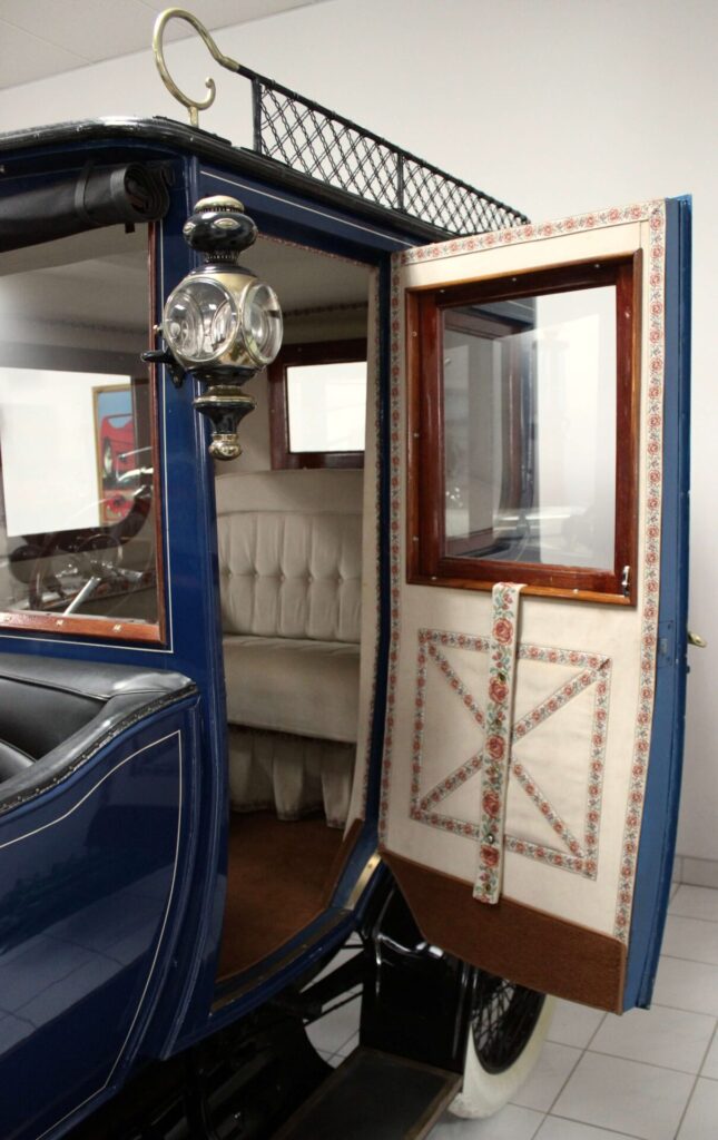 Highly ornate interior of a 1914 Delage. Even the door is embroidered.