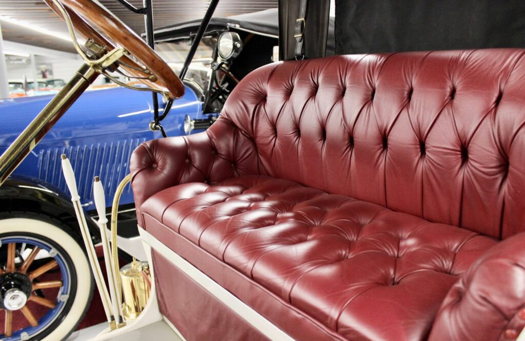 Close up of the red leather seat of a 1911 Buick, car of the horseless carriage era