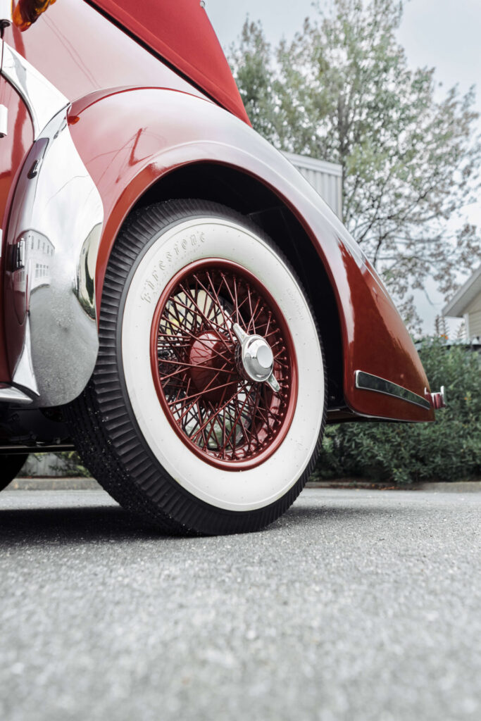 Close up of a white-flanked wheel of a classic car