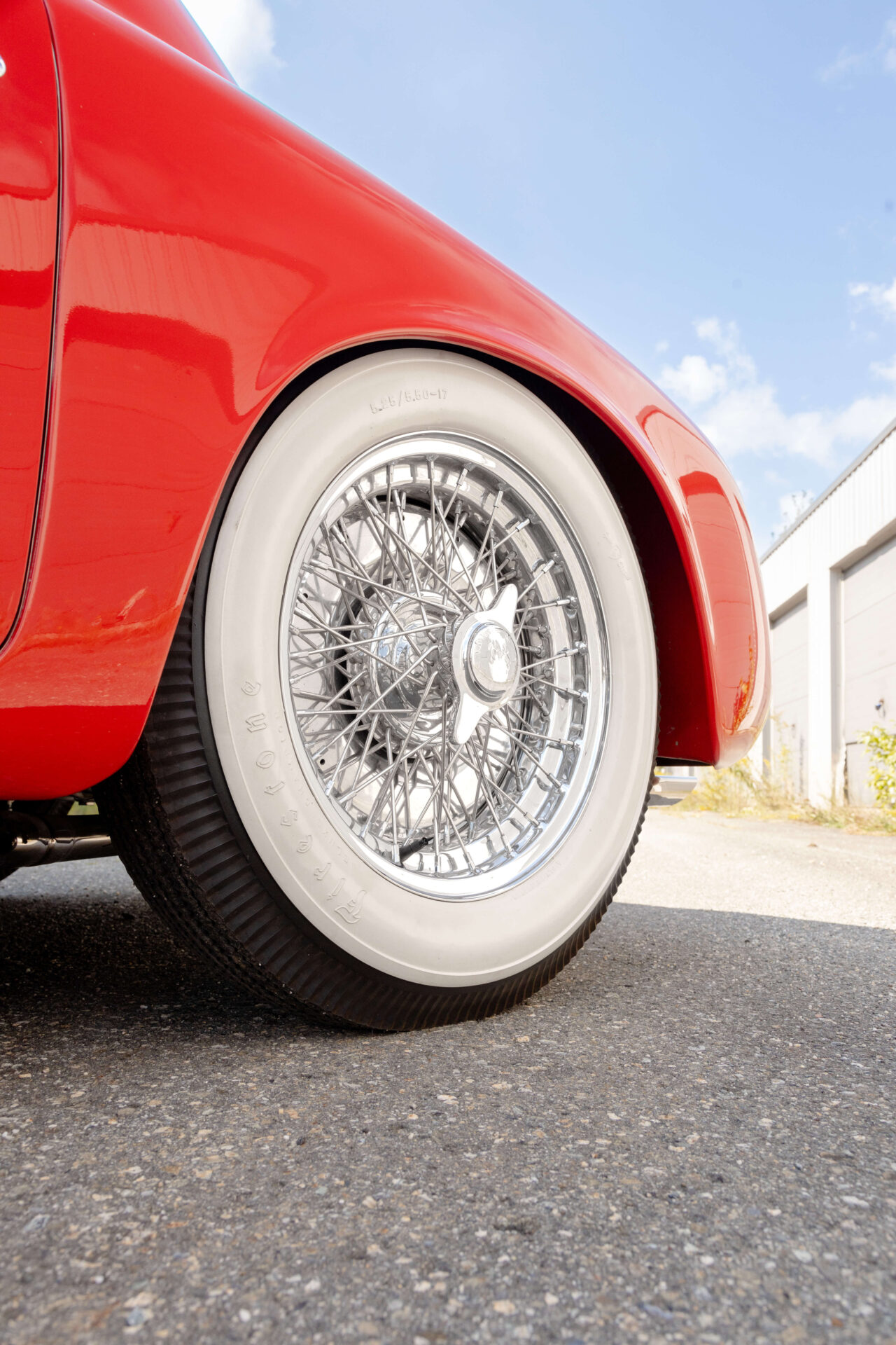 White-flanked tire on a red car