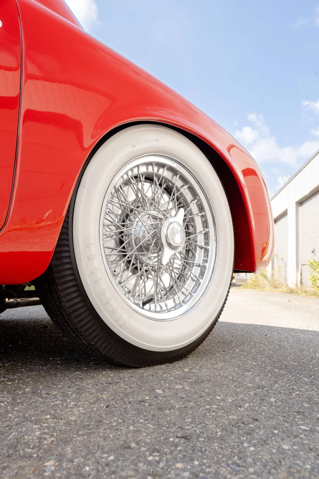 1929 Alfa Romeo Detail White-flanked tire on a red car