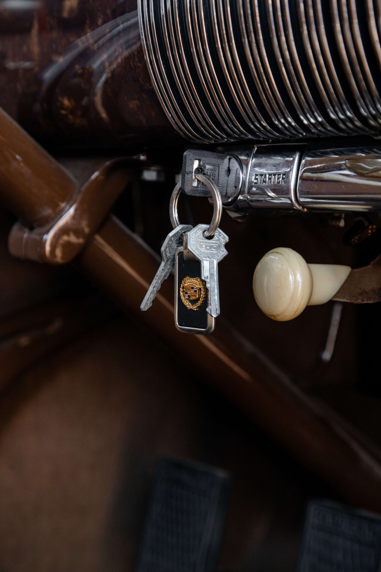 Close up of keys in the ignition of a 1931 Cadillac V16, the most innovative brand under the General Motors umbrella.